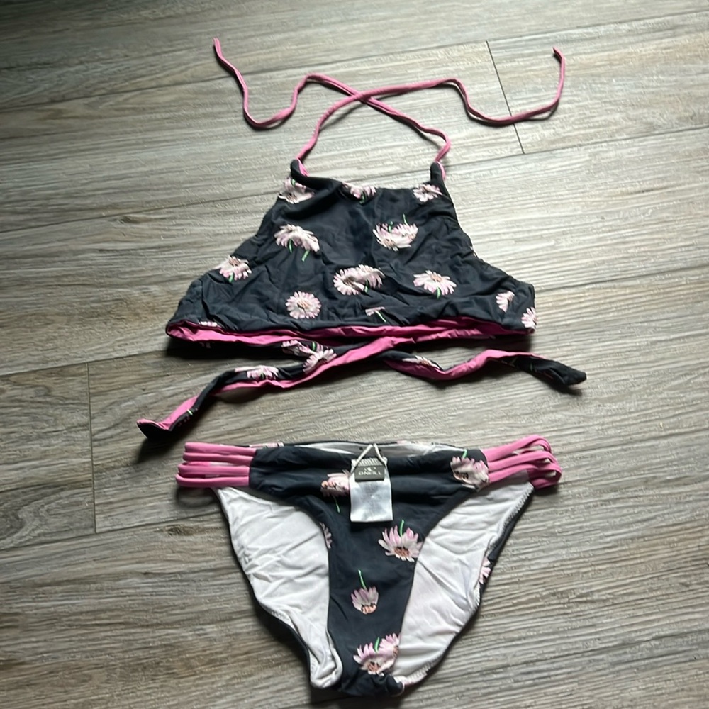 O’Neill kids bathing suit, look worn out but that is just the original color.